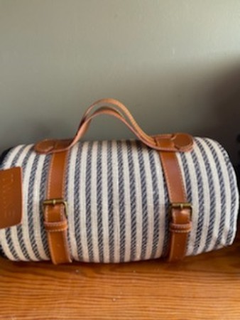 Picnic blanket with leather carrier